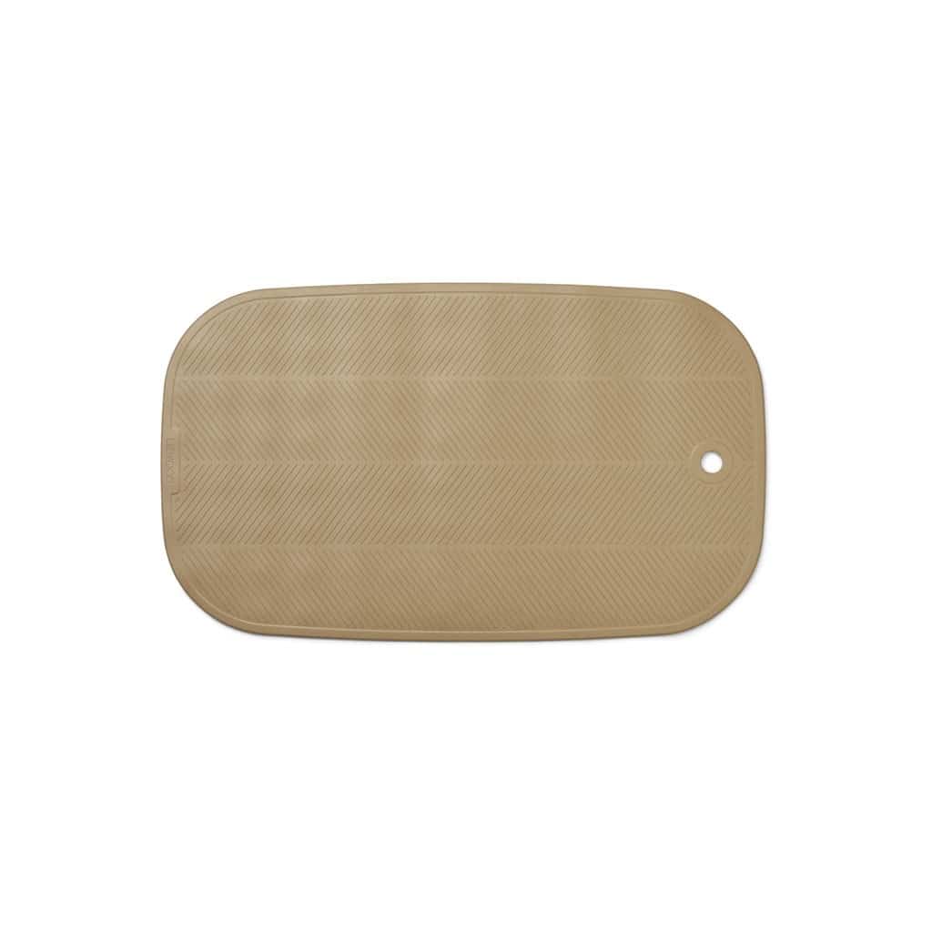 Un tapis de bain sable