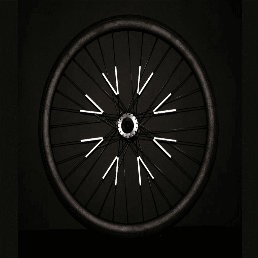 réflecteurs pour roues rose fluo rainette détail réflecteurs sur roue de nuit