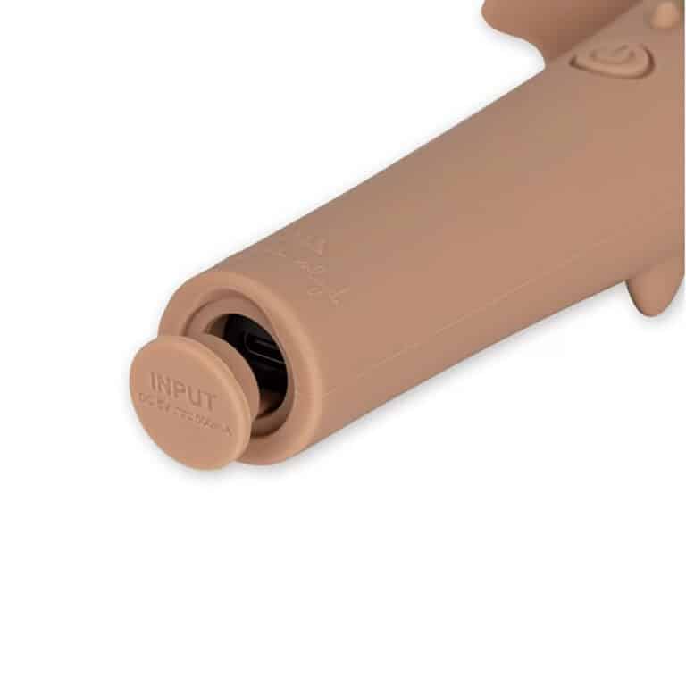 Lampe torche dragon rose poudré, vue de derrière sur fond