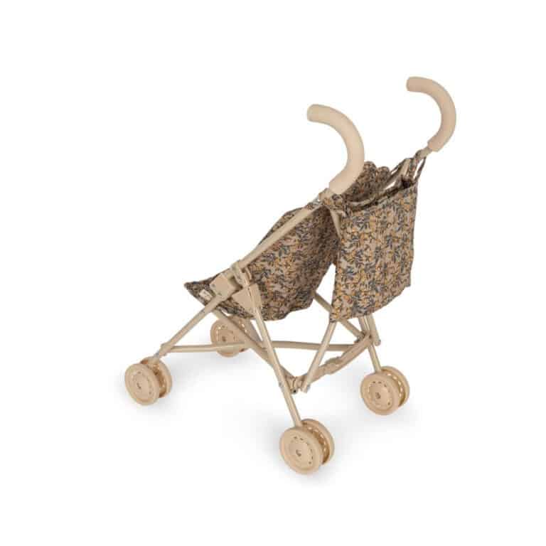 Une poussette pour poupées de la marque konges