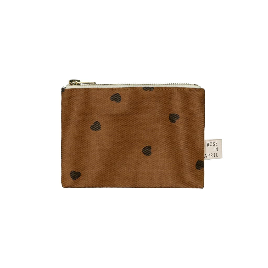 Un porte monnaie de couleur cumin avec des coeurs de la marque rose in april