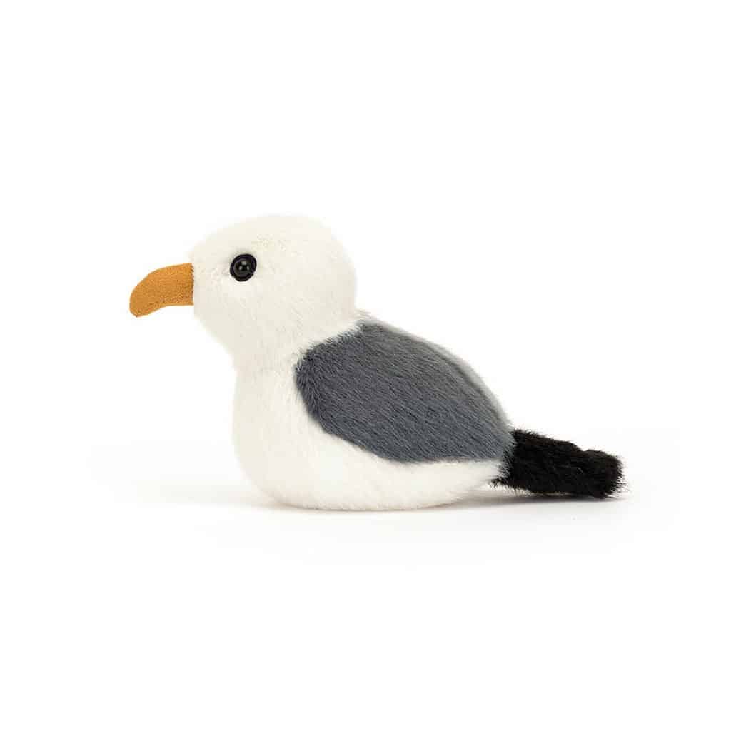 un mini doudou mouette, vue de côté sur fond blanc