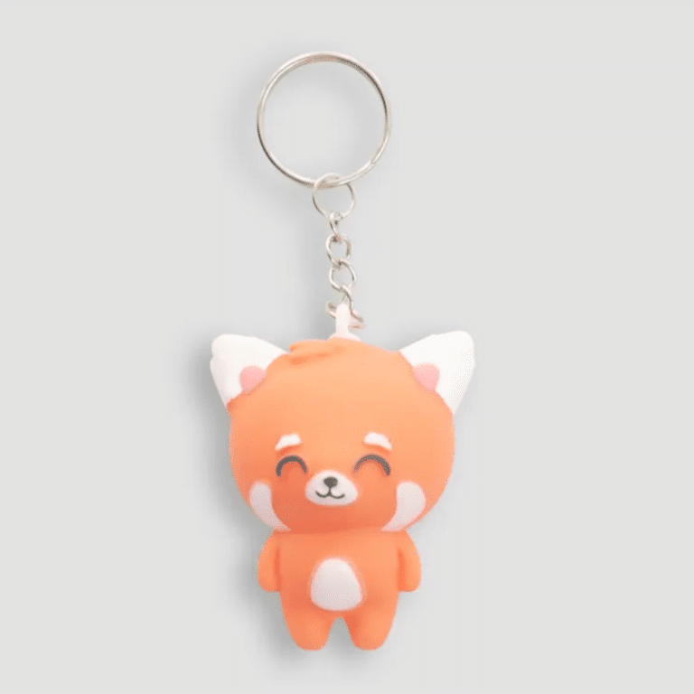 un porte clé en forme de panda roux lumineux, vue de face sur fond blanc