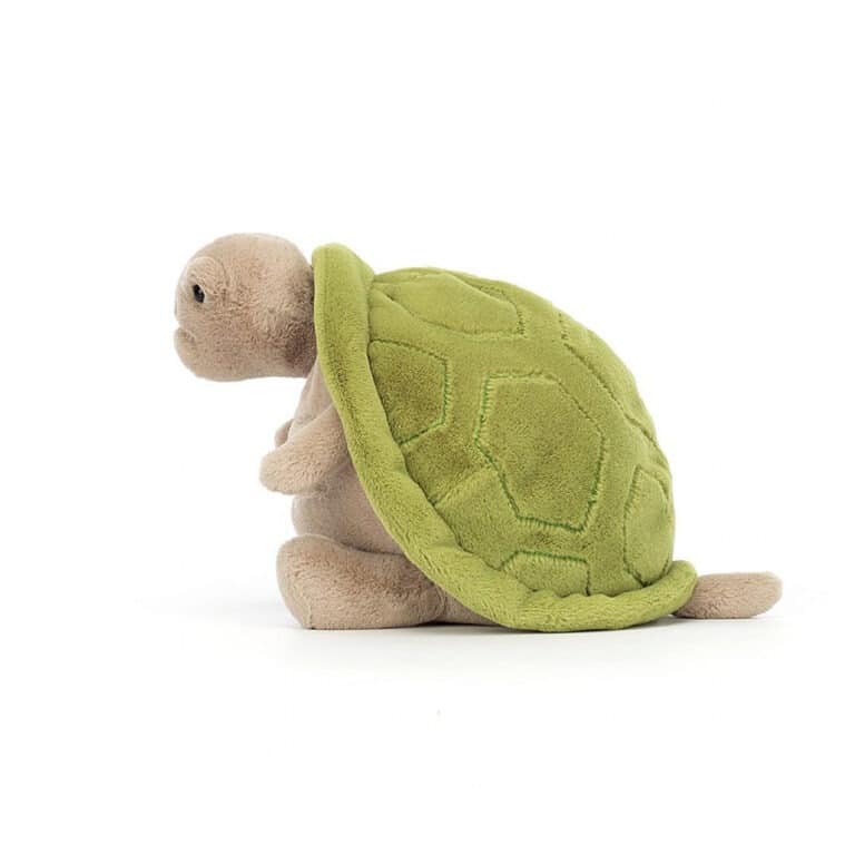 doudou tortue timmy, vue de côté sur fond