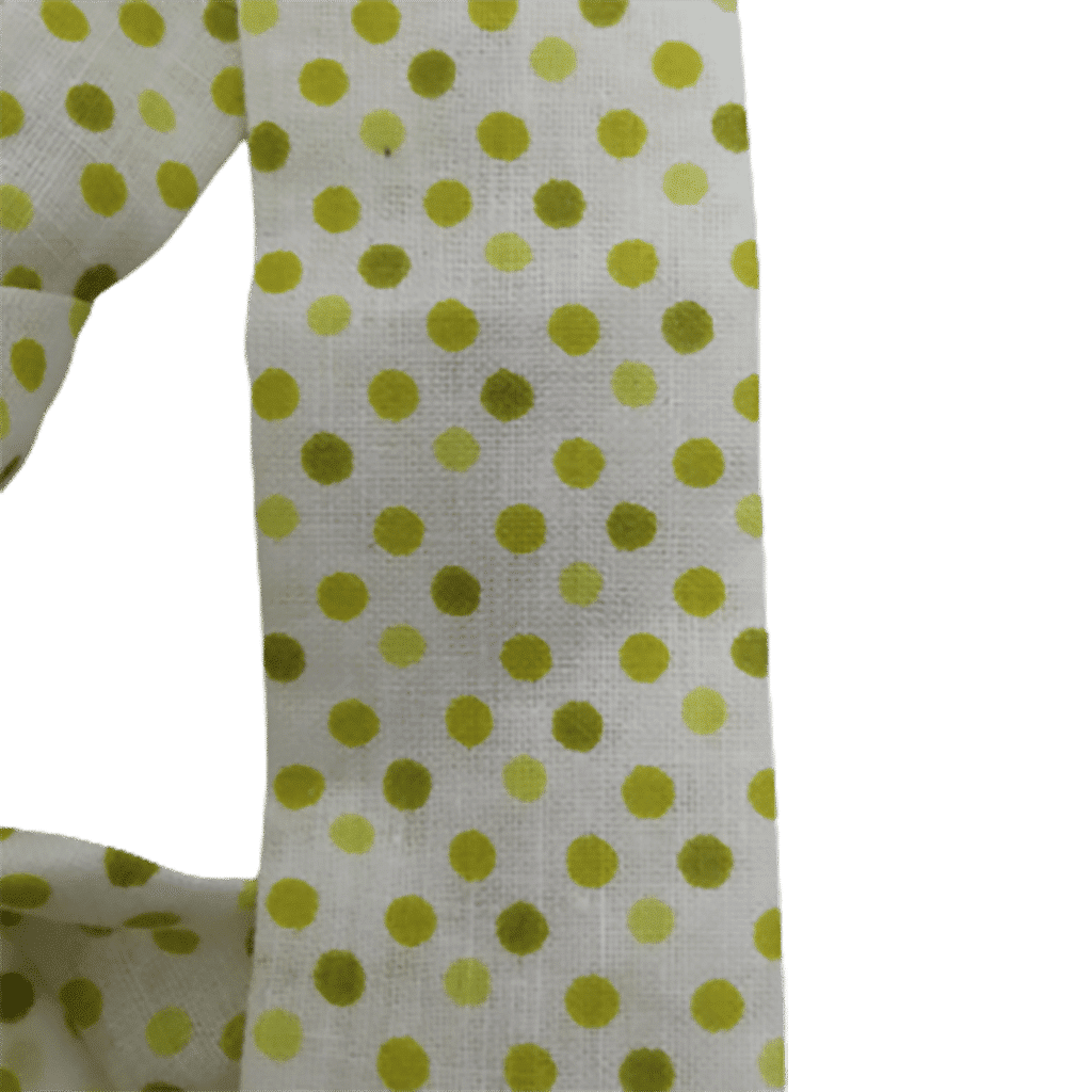 détail bandeau à pois verts sur fond blanc