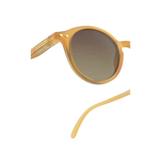 lunettes de soleil junior D 5-10ans golden glow izipizi détail verre sur fond blanc