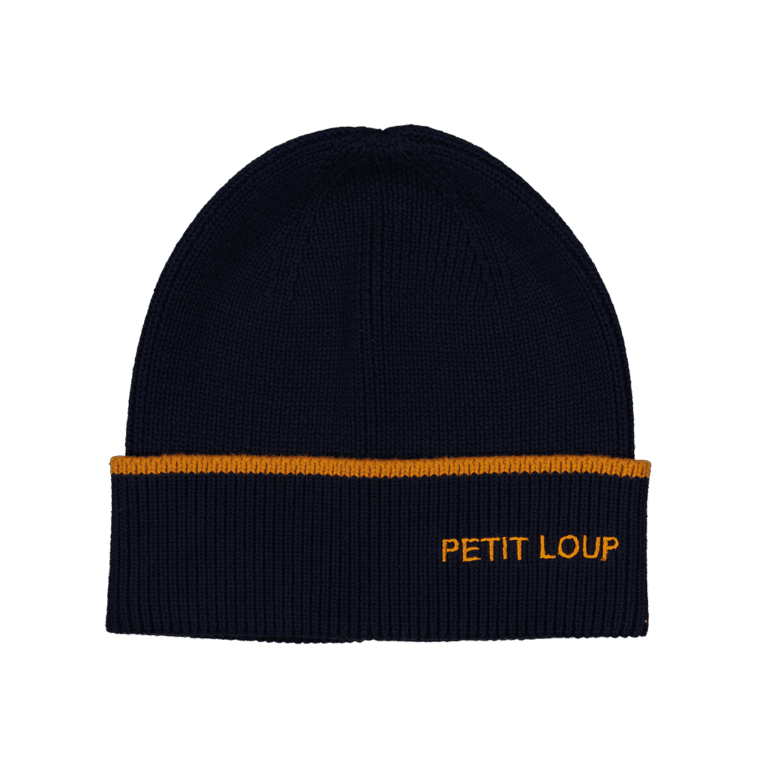 un bonnet "Petit loup" bleu marine chamaye, vue de face sur un fond décoré