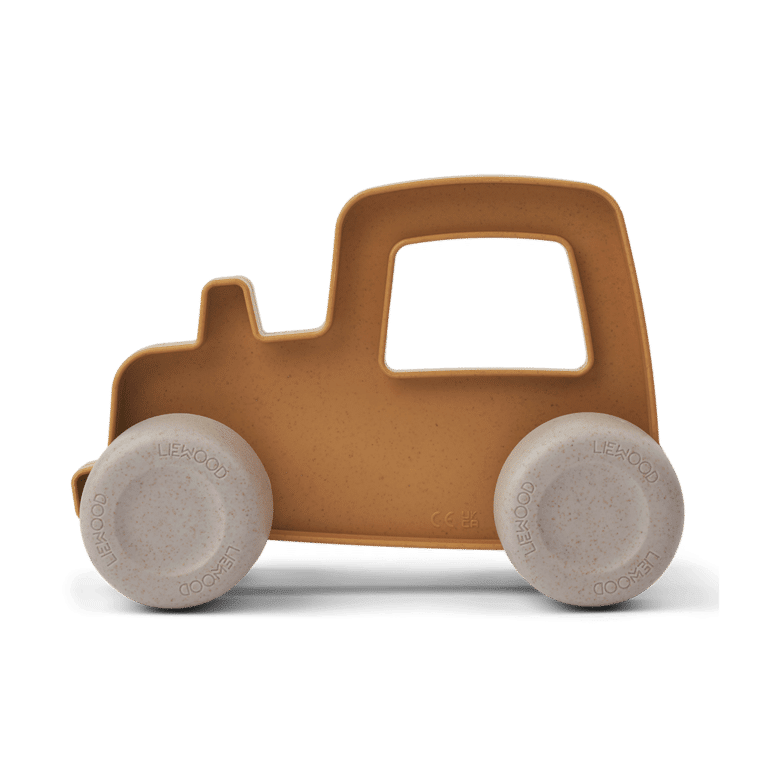 tracteur liewood jaune à roulettes vue de profil sur fond blanc