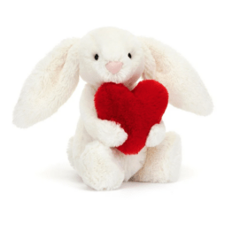 doudou lapin jellycat avec un coeur rouge de profil sur fond blanc