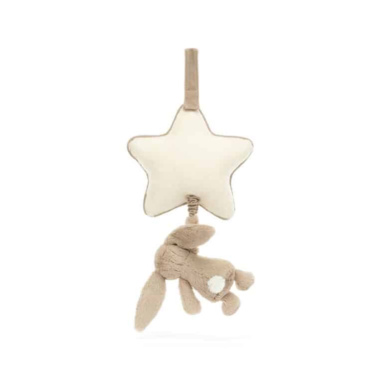 un lapin beige musicale avec son étoile Jellycat, vue de derrière sur fond blanc