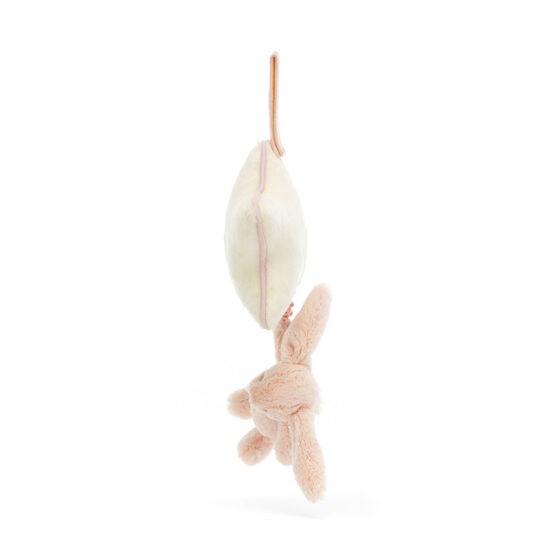 un doudou lapin rose musical Jellycat, vue de côté sur fond blanc