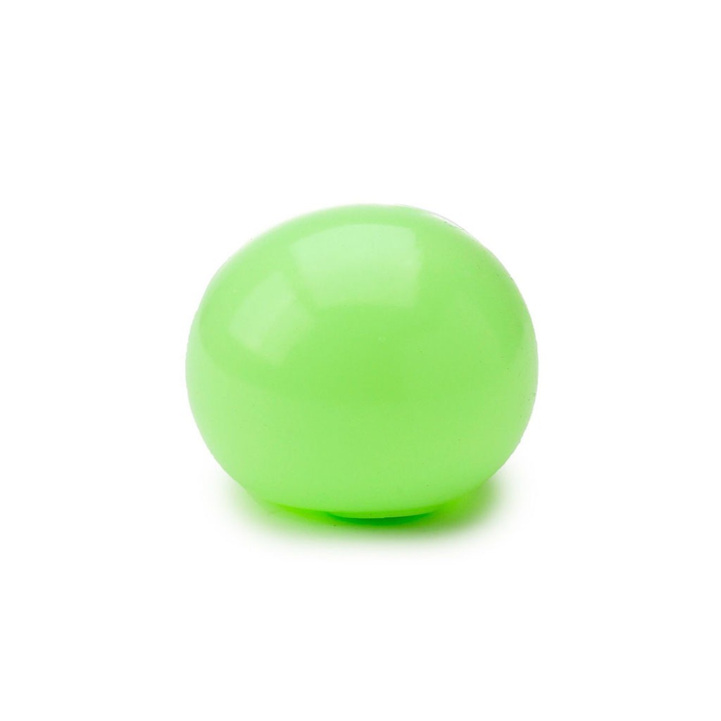 une balle anti-stress en maltose phosphorescente, vue de face sur fond blanc