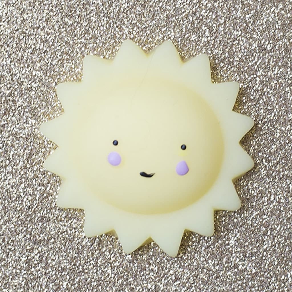 mini squishy soleil la petite épicerie sur surface doré