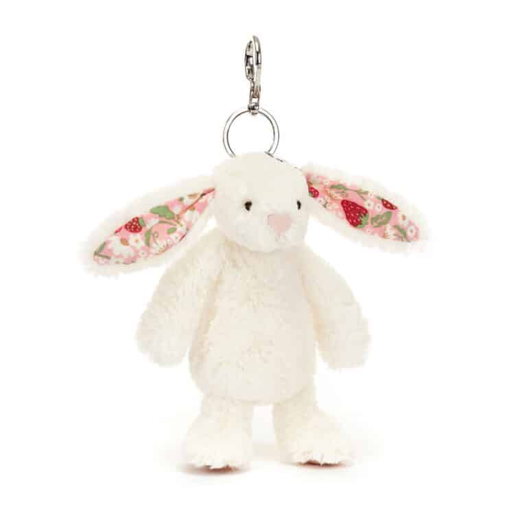 Porte-clé lapin crème aux oreilles petites fraises  –  Jellycat - Vu de face sur fond blanc