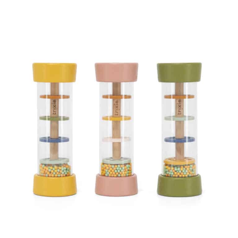 Bâton de pluie-Trixie- vu sur le côté de gauche à droite le lion, le chat, le dinosaure sur fond blanc